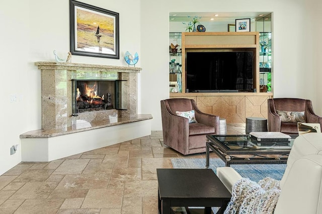 sitting room featuring a premium fireplace