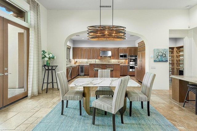 dining room featuring french doors and beverage cooler