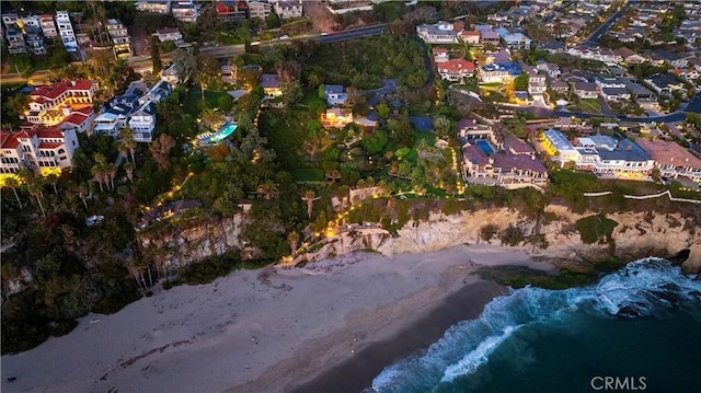 aerial view featuring a water view and a view of the beach