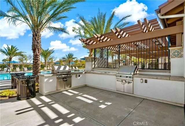 view of patio with area for grilling, a community pool, a pergola, and exterior kitchen