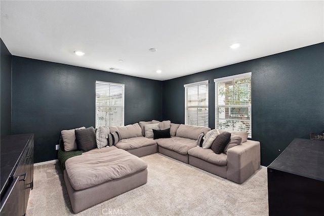 carpeted living room featuring a wealth of natural light