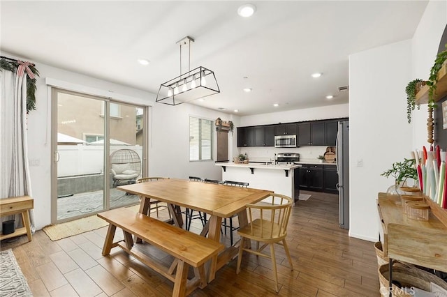 dining area with dark hardwood / wood-style floors