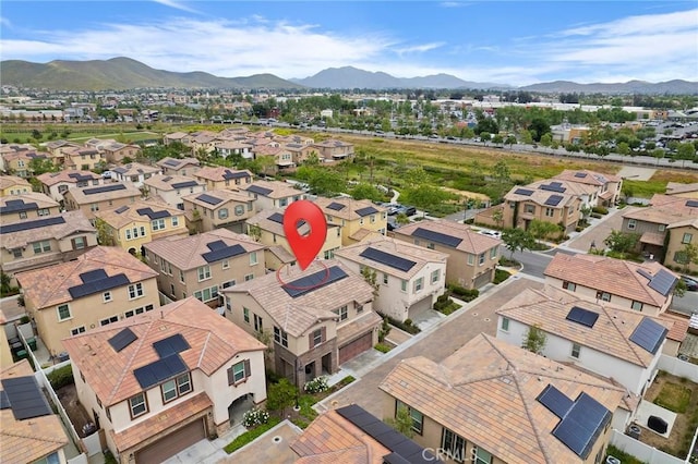 birds eye view of property featuring a mountain view