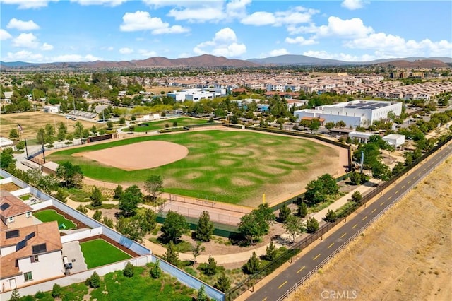 birds eye view of property featuring a mountain view