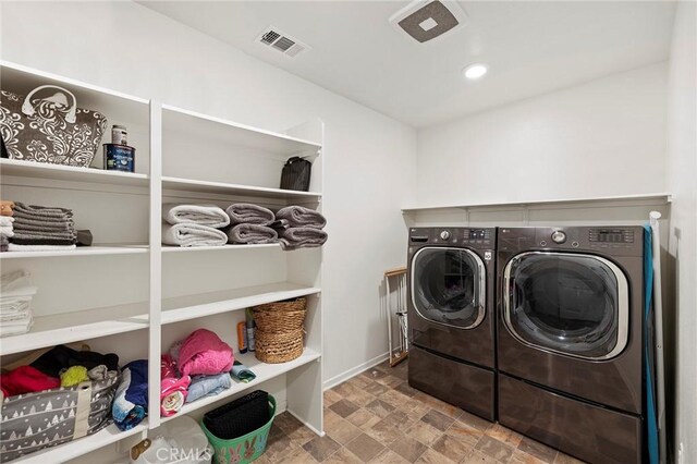 laundry area featuring independent washer and dryer