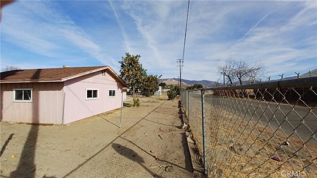 view of side of property with a mountain view