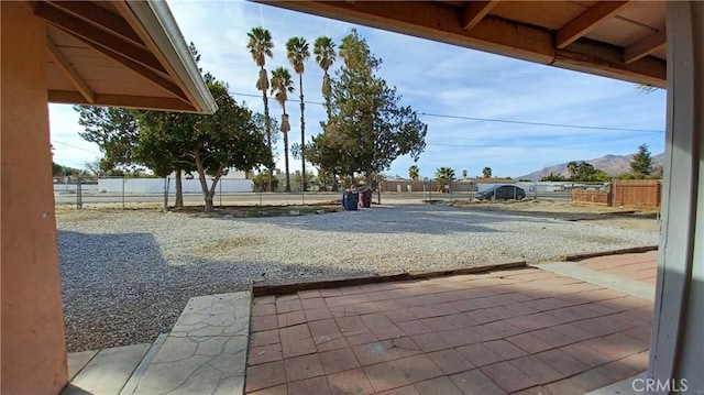 view of patio / terrace featuring a mountain view