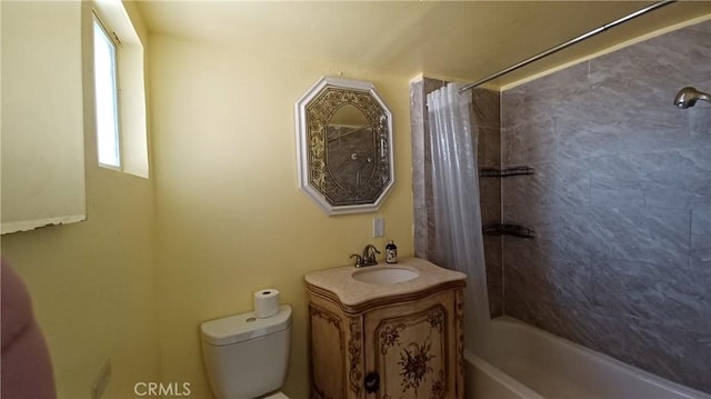 full bathroom featuring shower / bath combo, vanity, and toilet