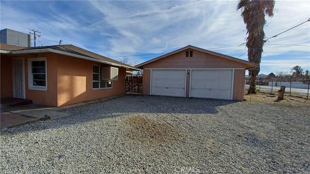 view of side of property with an outbuilding and a garage