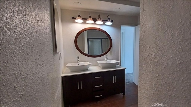 bathroom featuring vanity and hardwood / wood-style flooring