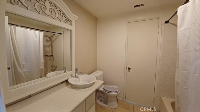 full bathroom featuring tile patterned flooring, vanity, toilet, and shower / bath combo with shower curtain