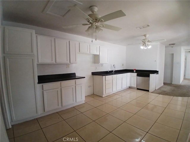 kitchen with ceiling fan, light tile patterned floors, a sink, visible vents, and dishwasher