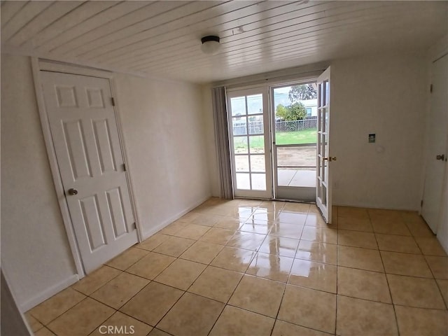 doorway to outside featuring french doors, wooden ceiling, and light tile patterned floors