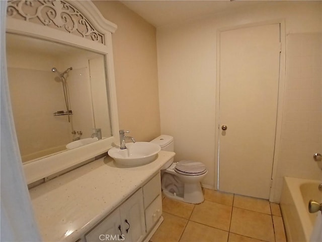 bathroom featuring shower / washtub combination, vanity, toilet, and tile patterned floors