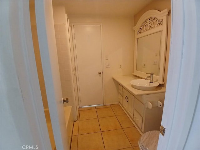 bathroom with vanity, toilet, and tile patterned floors