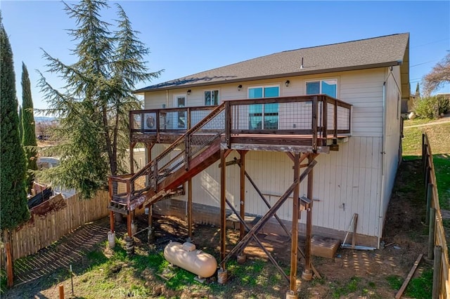 rear view of house featuring a deck