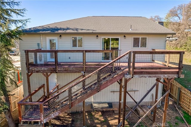 back of property with a wooden deck