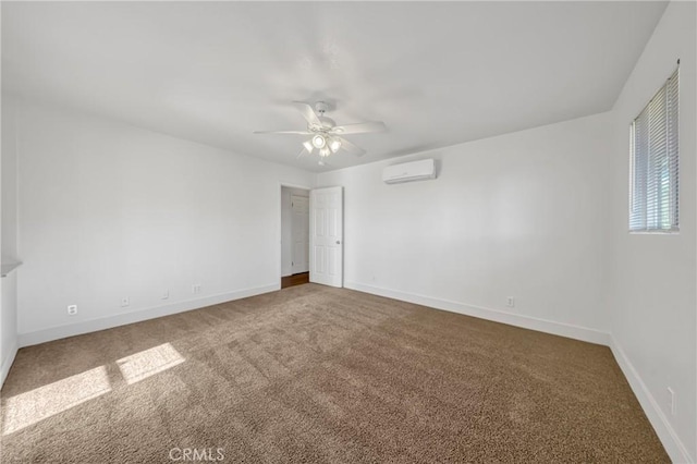 empty room with ceiling fan, carpet, and a wall unit AC