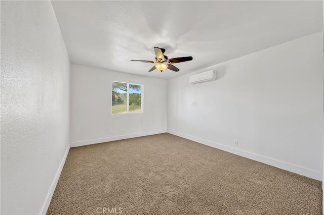 carpeted spare room with a wall mounted air conditioner and ceiling fan