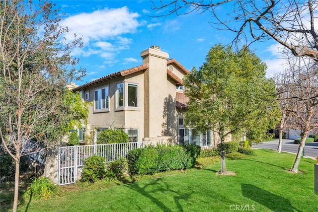 view of property exterior featuring a lawn