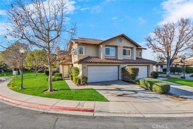 view of front of home with a garage and a front lawn