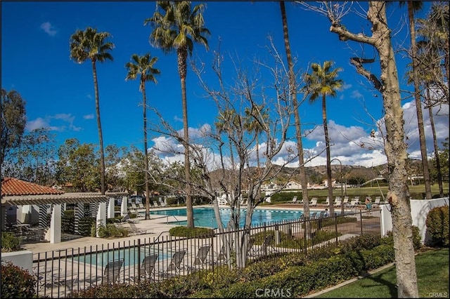 view of pool with a pergola and a patio area