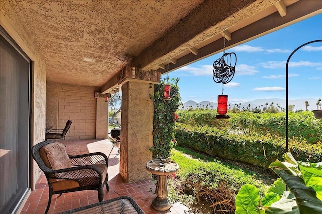 view of patio / terrace featuring a mountain view