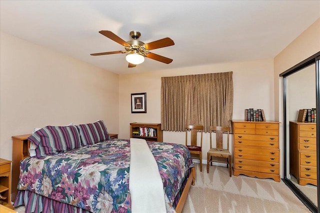 bedroom with ceiling fan and light carpet