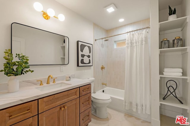 full bathroom featuring vanity, tile patterned floors, toilet, and shower / bath combo with shower curtain