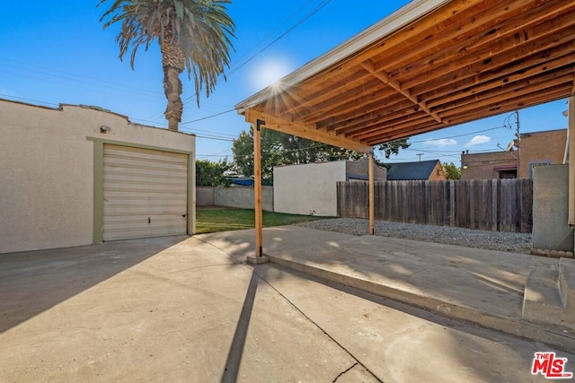 view of patio with a garage