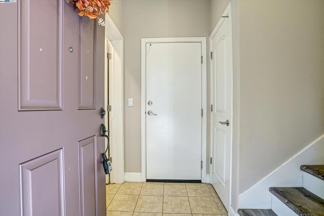 entryway featuring light tile patterned floors