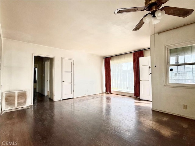 unfurnished room featuring dark hardwood / wood-style flooring and ceiling fan