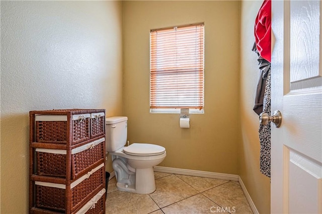 bathroom with tile patterned floors and toilet