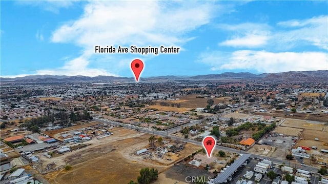 birds eye view of property featuring a mountain view