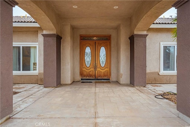 property entrance with a patio