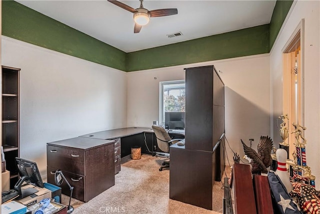 office space with ceiling fan and light carpet