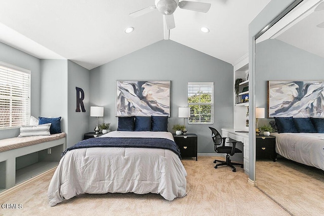 carpeted bedroom with lofted ceiling and ceiling fan