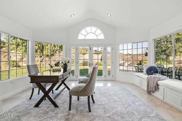 sunroom featuring plenty of natural light, french doors, and vaulted ceiling