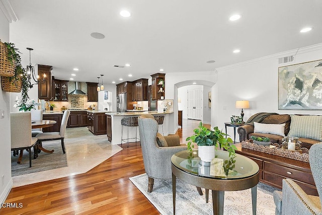 living room featuring hardwood / wood-style floors and ornamental molding