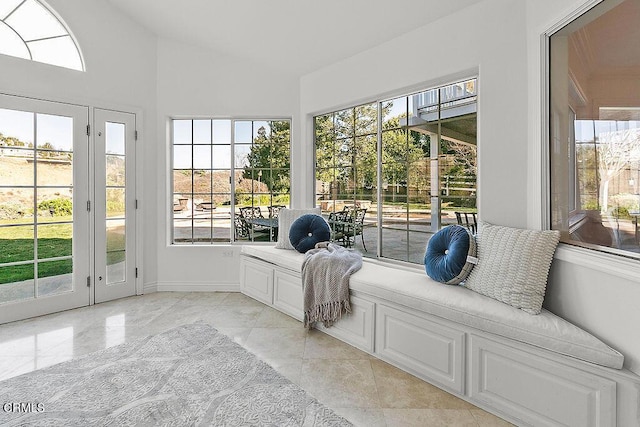 unfurnished sunroom featuring vaulted ceiling