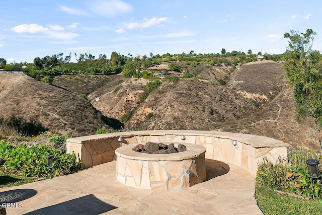 view of patio with a fire pit