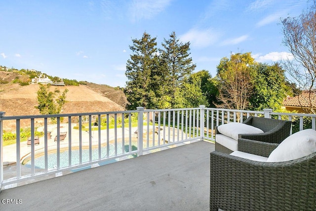 balcony featuring a patio area