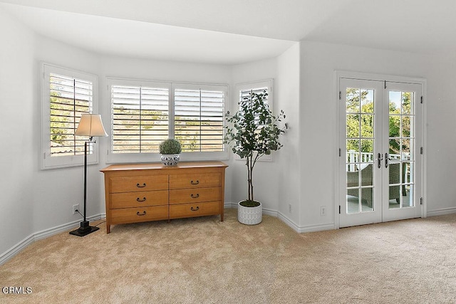 interior space with access to outside and french doors