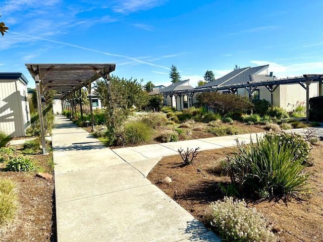 surrounding community with a pergola