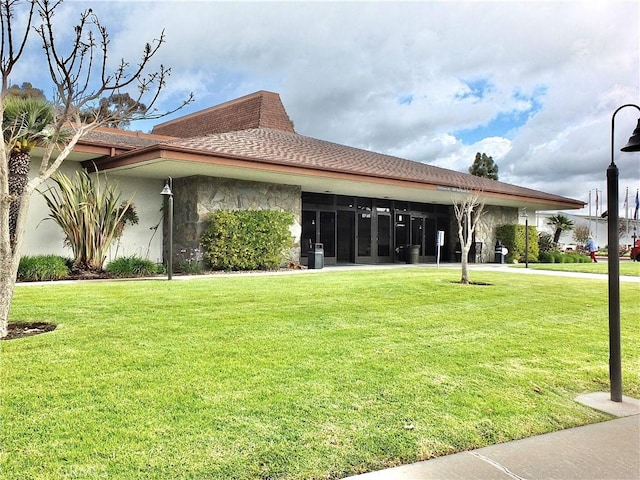 view of property exterior with a yard