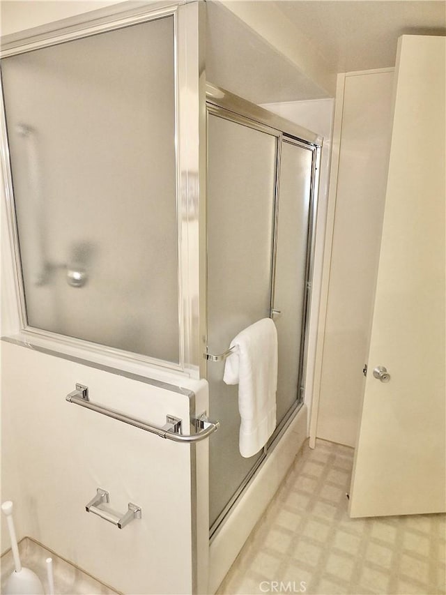 bathroom featuring an enclosed shower