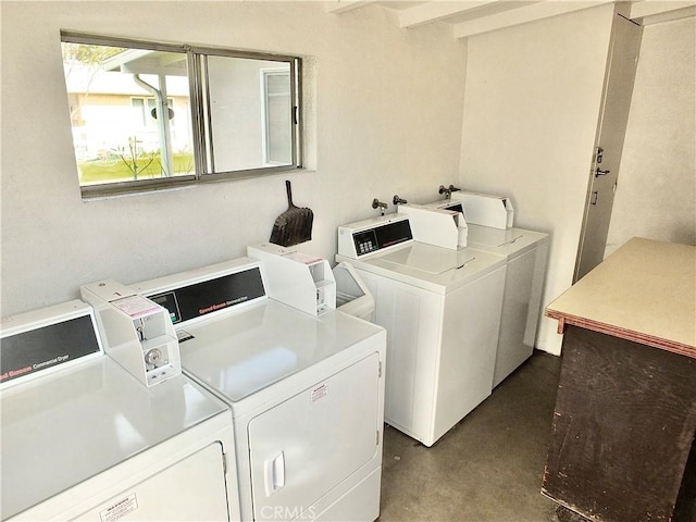 laundry room featuring washer and clothes dryer