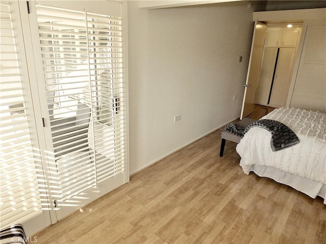 bedroom with light hardwood / wood-style flooring