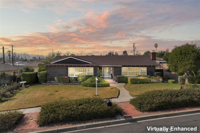 ranch-style house with a yard