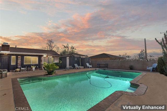 view of pool with a fenced in pool, a patio area, and a fenced backyard